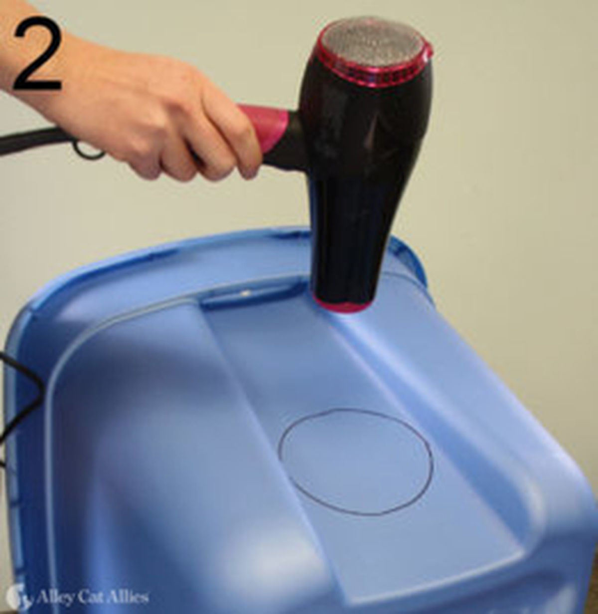 During a class on how to build a shelter for feral cats using a storage tote, Avery Gunther, outreach coordinator for SAFE Haven for Cats, said a hair dryer can be used to warm the plastic for easier cutting.