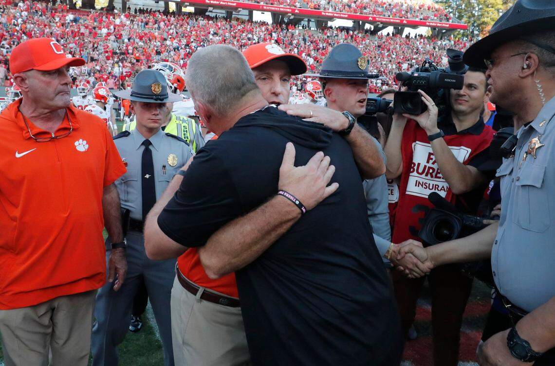 Clemson head coach Dabo Swinney talks with N.C. State head coach Dave Doeren after the Wolfpack’s 24-17 victory over Clemson at Carter-Finley Stadium in Raleigh, N.C., Saturday, Oct. 28, 2023.