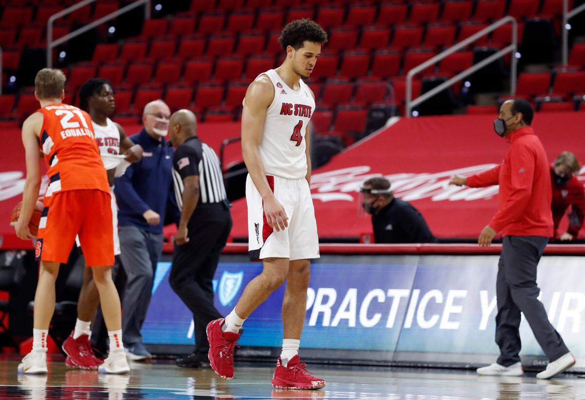 N.C. State’s Jericole Hellems (4) walks off the court after Syracuse’s 77-68 victory over N.C. State at PNC Arena in Raleigh, N.C., Tuesday, February 9, 2021.