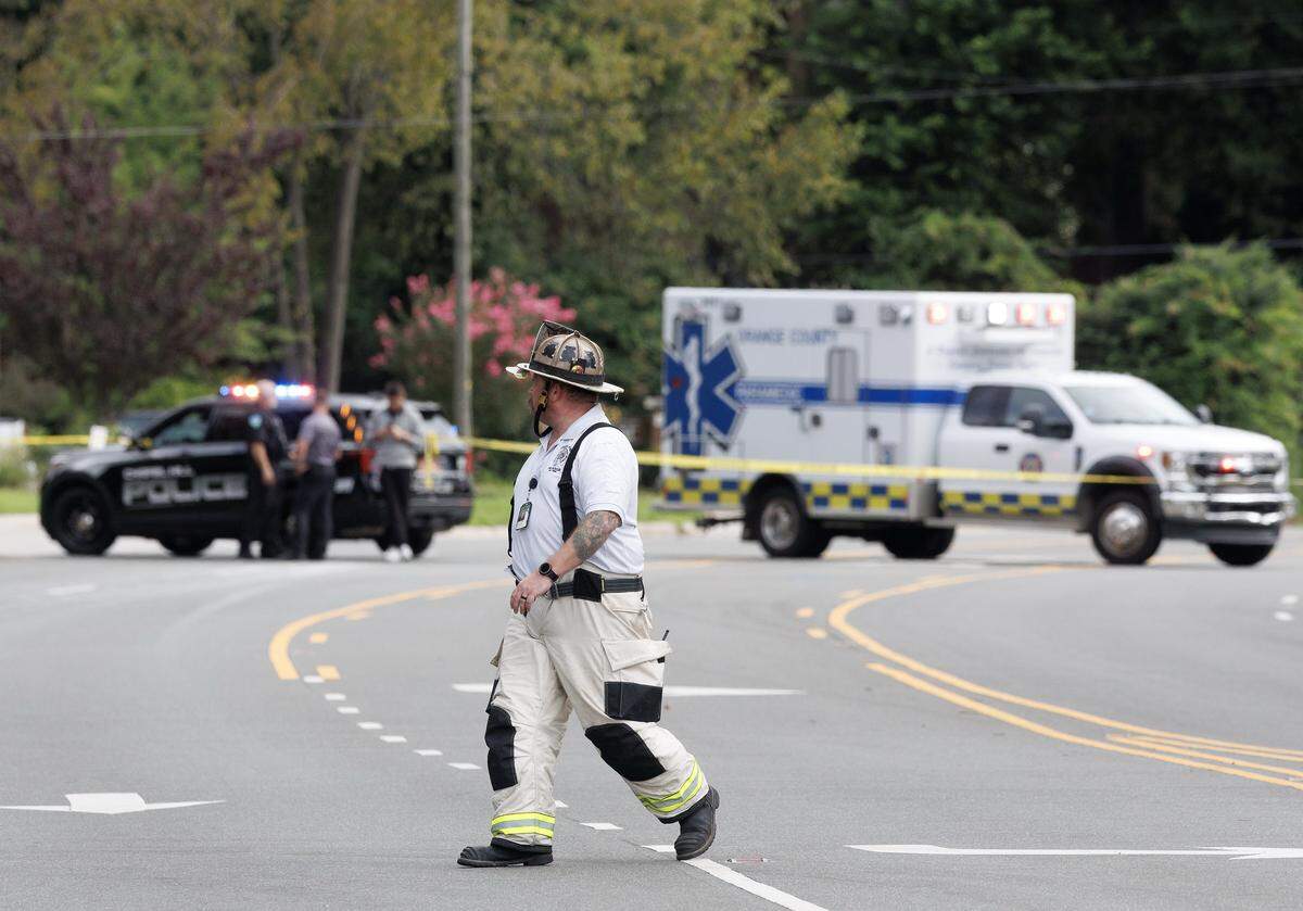 Fire and law enforcement personnel block a portion of East Franklin Street near the Siena Hotel in Chapel Hill, N.C., Friday morning, August 22, 2025.