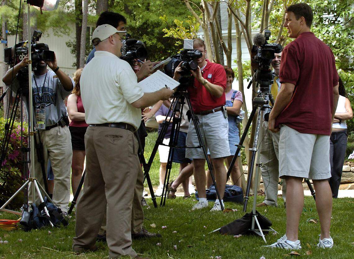 Former N.C. State quarterback and NFL first round draft pick Philip Rivers talks with members of the media about being picked by the NY Giants and traded to the San Diego Chargers, Saturday, April 24, 2004. He held an informal press conference in front of his parents house in Raleigh, NC where he watched the draft with his family.