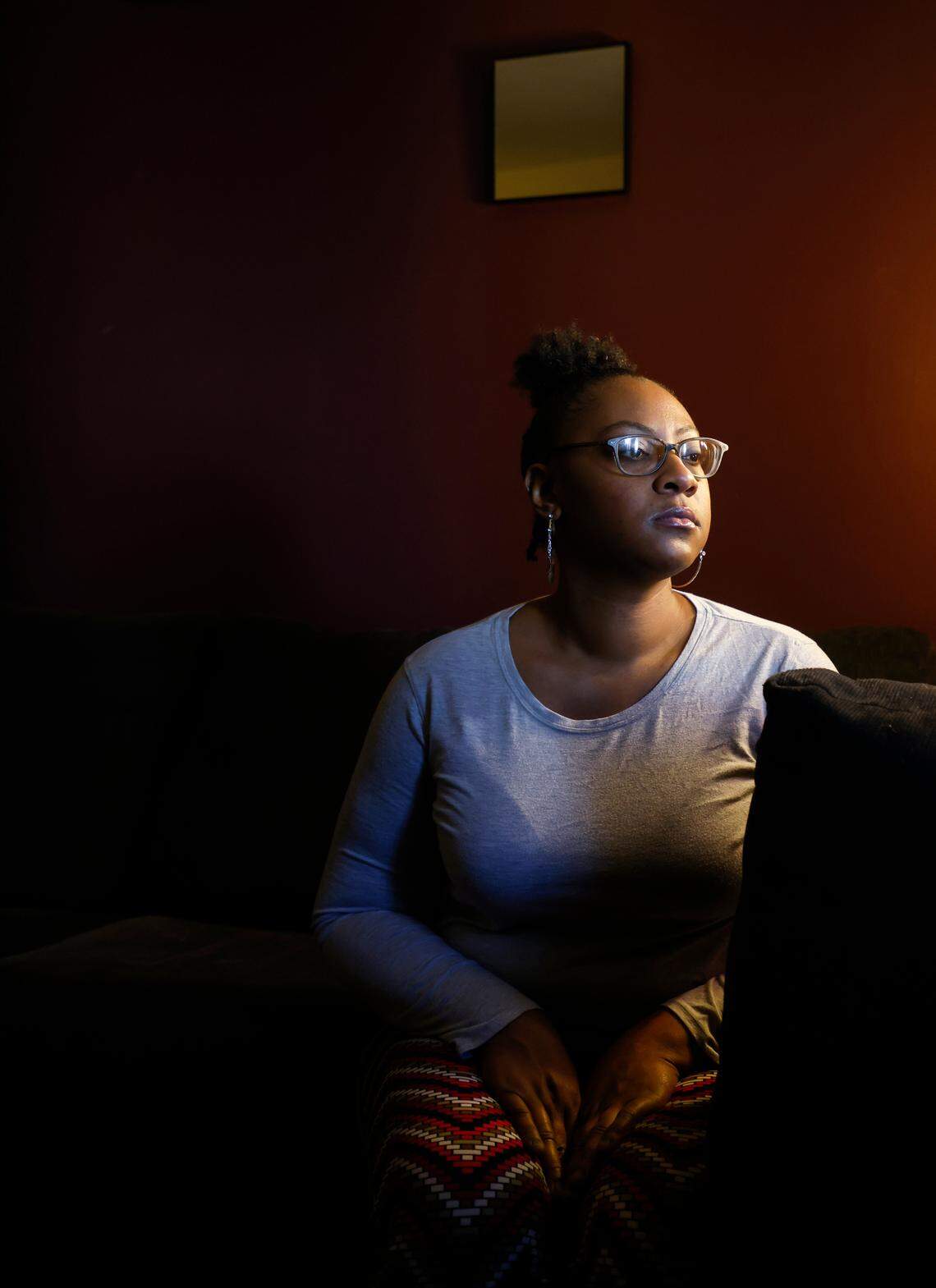 Portia Watson, 33, is photographed before moving out of her Durham, N.C. apartment on Friday, Dec. 30, 2022. Watson says she received notice that her lease would not be renewed after she took in neighbors from the same complex. She resigned from her job and plans to live with her mother in Burlington, N.C.