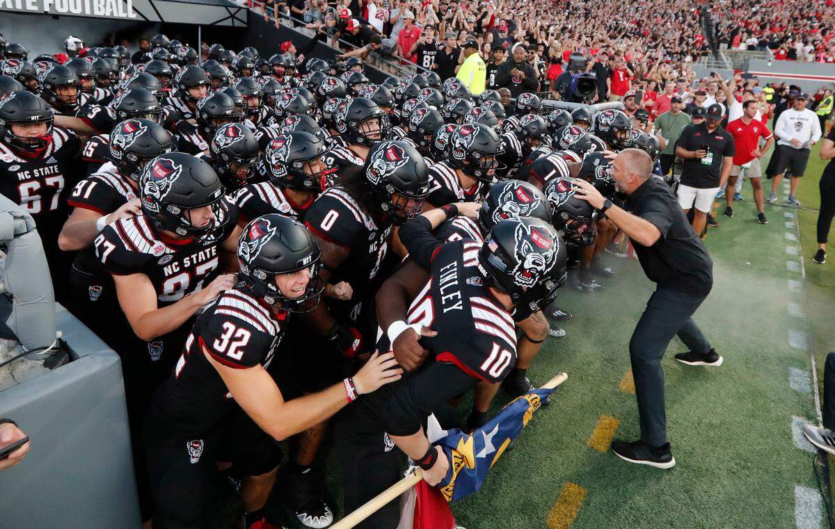 N.C. State head coach Dave Doeren gets ready to lead the team out onto the field before N.C. State’s game against Texas Tech at Carter-Finley Stadium in Raleigh, N.C., Saturday, Sept. 17, 2022.