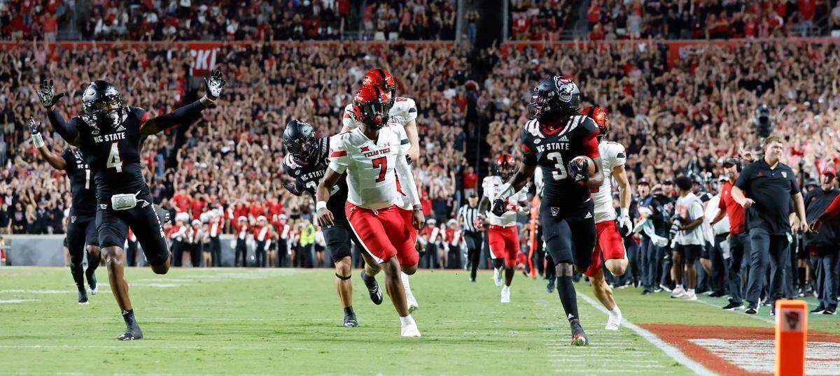 N.C. State cornerback Aydan White (3) returns the interception 84-yards for a touchdown during the first half of N.C. States game against Texas Tech at Carter-Finley Stadium in Raleigh, N.C., Saturday, Sept. 17, 2022.