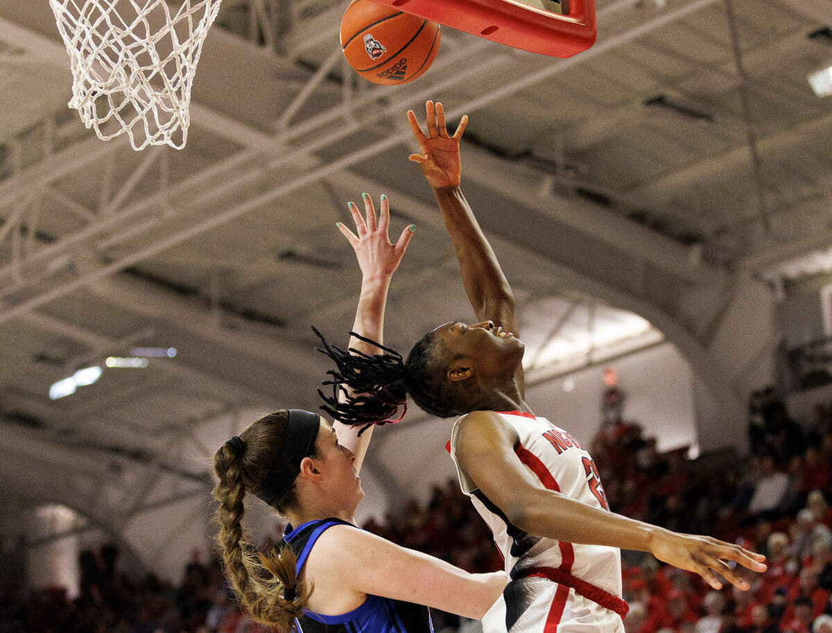 N.C. State’s Saniya Rivers is fouled as she lays in the ball over Duke’s Kennedy Brown during the second half of the Wolfpack’s 72-57 win on Sunday, Jan. 21, 2024, at Reynolds Coliseum in Raleigh, N.C.