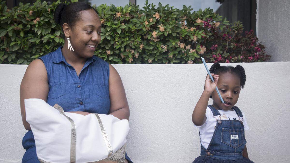 Katrina Wallace and her daughter Kamia Street, 4, wait for their car at a car wash in Durham, N.C. Wallace and her daughter live in Southpoint Glen Apartments in Durham. Wallace was forced to go on disability after two brain surgeries, and fell short on rent while waiting to receive her first check. She had saved for this but ran out of funds before the benefits process was complete. She communicated her situation extensively to the apartment’s office, yet was turned down when she presented them with social services vouchers and a check with the last of her savings, because it wasn’t the full amount up front. The complex began processing her eviction and charged her another fee of $201 to cover eviction court costs. Once all of her funds arrived and the fees were paid, she was able to remain in her apartment but sought legal counsel when she was denied a receipt for the court fee and never had to appear in court.