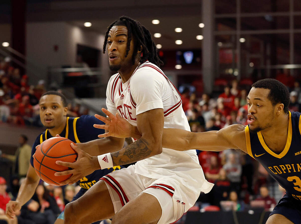 N.C. State’s Jayden Taylor drives [ast Coppin State’s Cam’Ron Brown during the first half of the Wolfpack’s 66-56 win on Tuesday, Dec. 10, 2024, at Reynolds Coliseum in Raleigh, N.C.