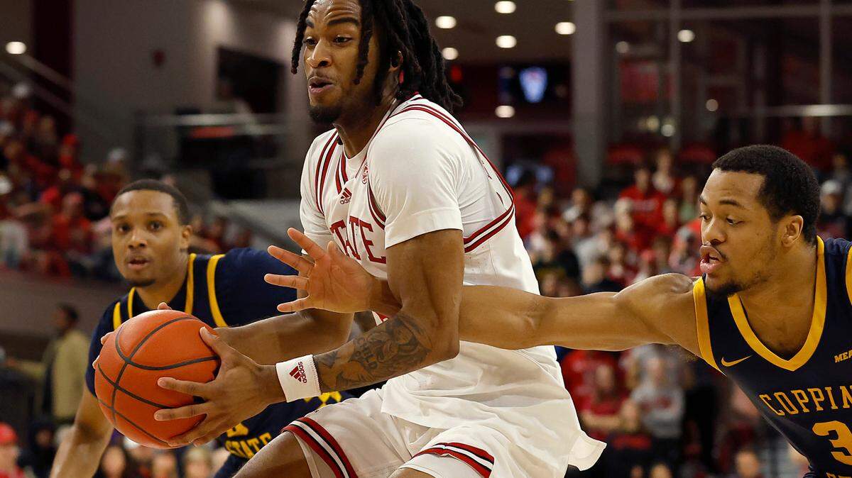N.C. State’s Jayden Taylor drives past Coppin State’s Cam’Ron Brown during the first half of the Wolfpack’s 66-56 win on Tuesday, Dec. 10, 2024, at Reynolds Coliseum in Raleigh, N.C.