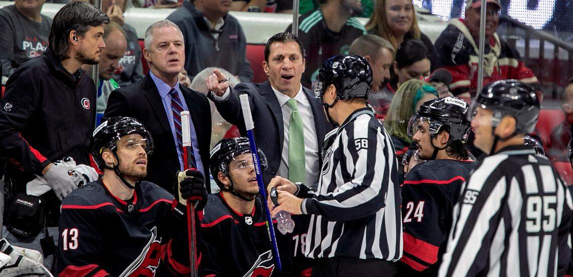 Carolina Hurricanes coach Rod BrindíAmour confers with referee Ryan Gibbons in the third period on Friday, May 20, 2022 during game two of the Stanley Cup second round against the New York Rangers at PNC Arena in Raleigh, N.C.