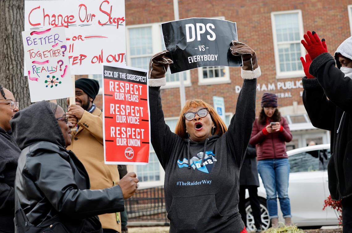 Doris Dickerson, an administrative assistant at Githens Middle School, center, and others protest outside the Durham Public Schools administrative building in Durham, N.C., Wednesday, Jan. 31, 2024. Twelve Durham public schools were closed Wednesday as staff — furious about unresolved salary issues — called in sick to attend protests.