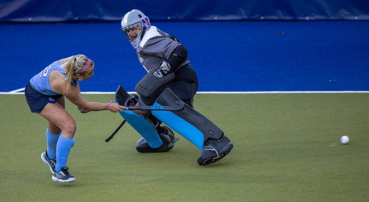 North Carolina’s Ryleigh Heck (12) scores the game winning goal in a sudden death shootout on Northwestern goalie Annabel Skubisz to clinch the NCAA Division I Field Hockey Championship on Sunday, November 19, 20223 at Karen Shelton Stadium in Chapel Hill, N.C.