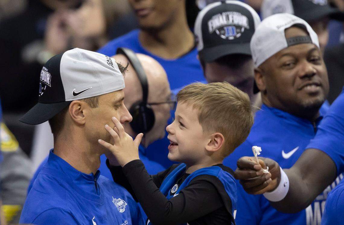 Duke coach Jon Scheyer embraces his son Jett as the Blue Devils celebrate their 85-65 victory over Alabama on Saturday, March 29, 2025 during the NCAA East Regional final at Prudential Center in Newark, N.J.