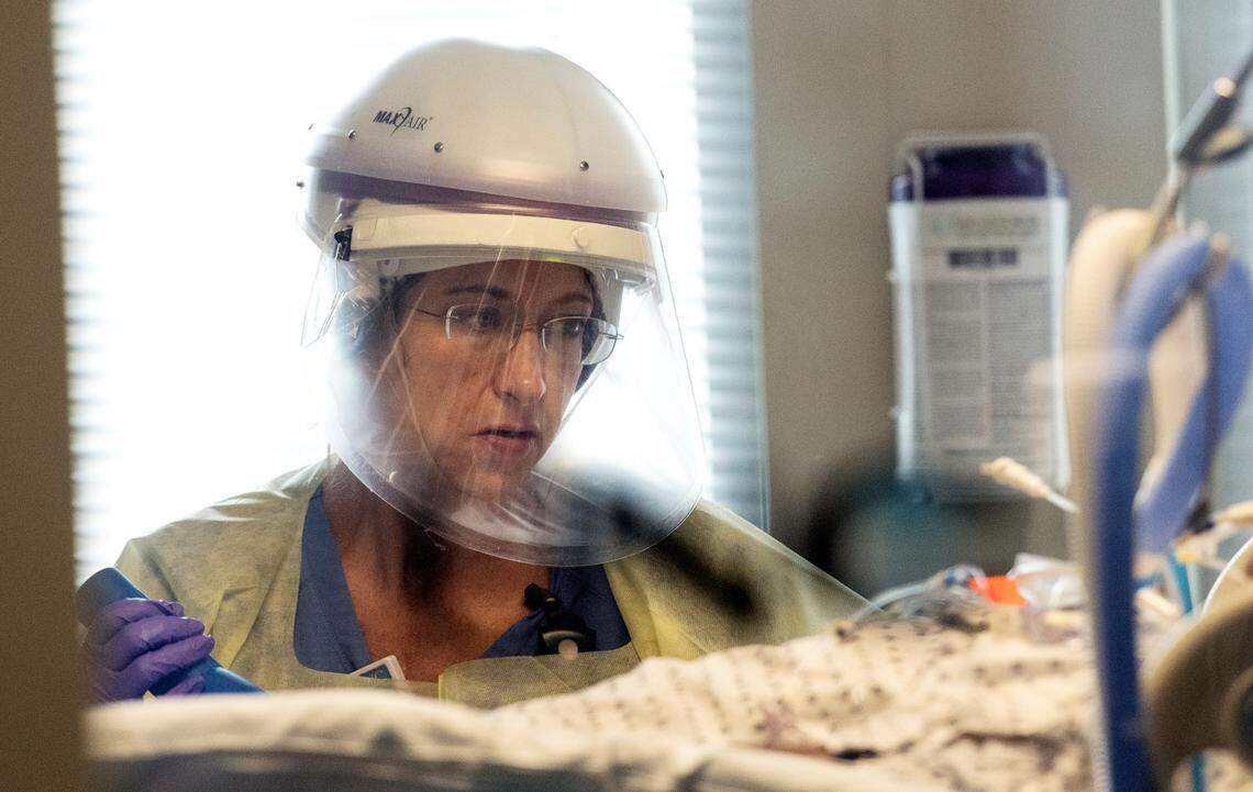 Angela Collins, RN, monitors a COVID patient in the medical intensive care unit (MICU) at UNC Hospital in Chapel Hill, N.C. Monday, June 16, 2020.