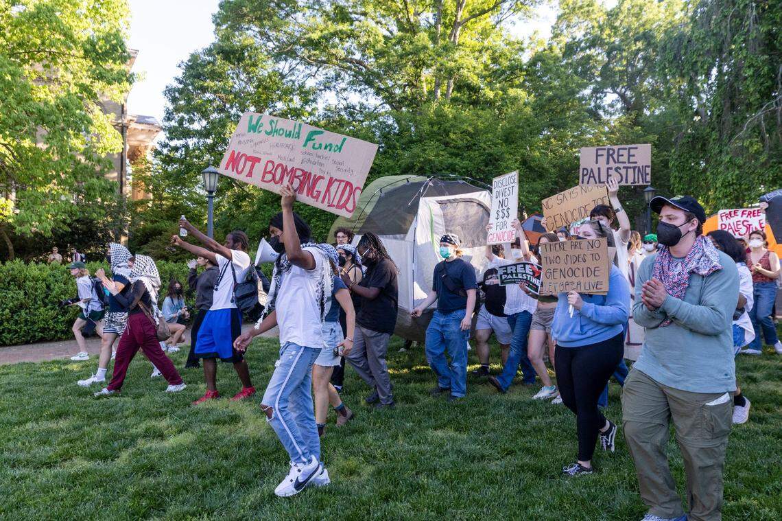 Demonstrators march outside an event attended by former UNC-Chapel Chancellor Kevin Guskiewicz during a pro-Palestinian protest and encampment at UNC Chapel Hill on Monday, April 29, 2024.
