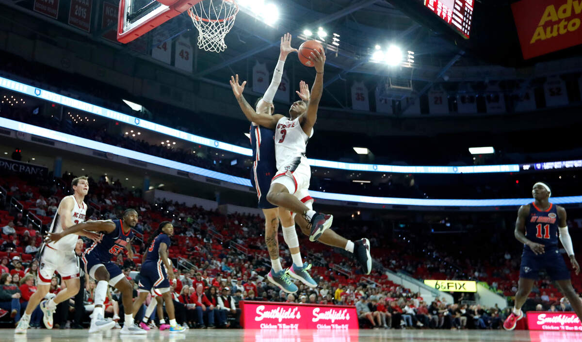 N.C. State’s MJ Rice (3) drives to the basket as UT Martin’s Jacob Crews (35) defends during N.C. State’s 81-67 victory over UT Martin at PNC Arena in Raleigh, N.C., Tuesday, Dec. 12, 2023.