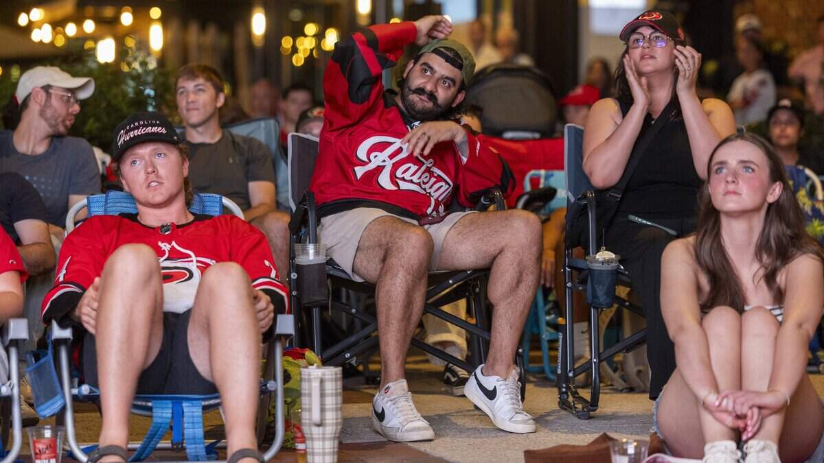 Carolina Hurricanes fans react during a Stanley Cup Final watch party in Raleigh's Smoky Hollow district on Tuesday, June 9, 2026, as the Hurricanes play the Vegas Golden Knights in Game 4 of the Stanley Cup Final.