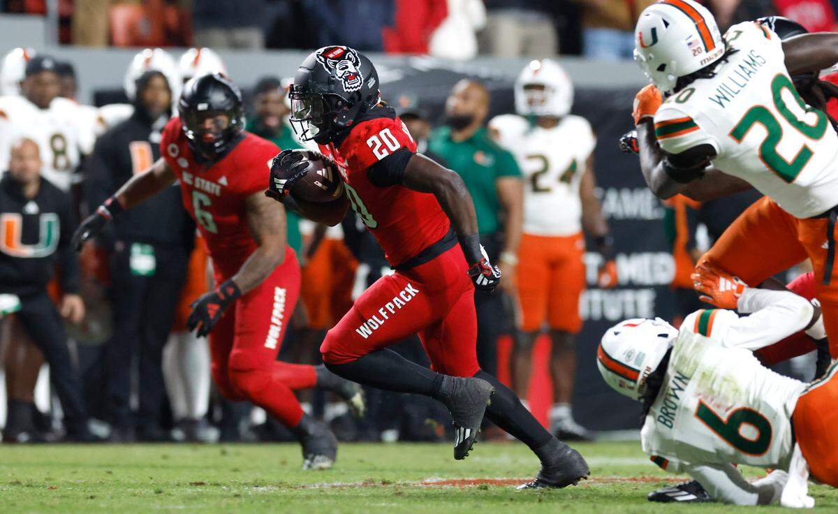 N.C. State running back Kendrick Raphael (20) breaks free for a 31-yard touchdown run in the second half of N.C. State’s 20-6 victory over Miami at Carter-Finley Stadium in Raleigh, N.C., Saturday, Nov. 4, 2023.