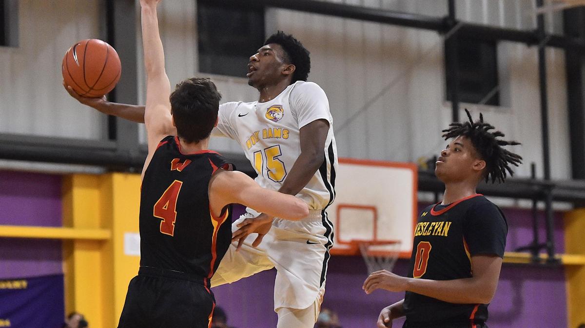 Word of God’s Chase Forte (15) attempts the layup against Wesleyan Christian’s Jacob Chrapliwy (4) and Kaleb Brooks (0) during the fourth quarter. The Word of God Holy Rams and the Wesleyan Christian Academy met in a basketball game in Raleigh, N.C. on January 28, 2020.