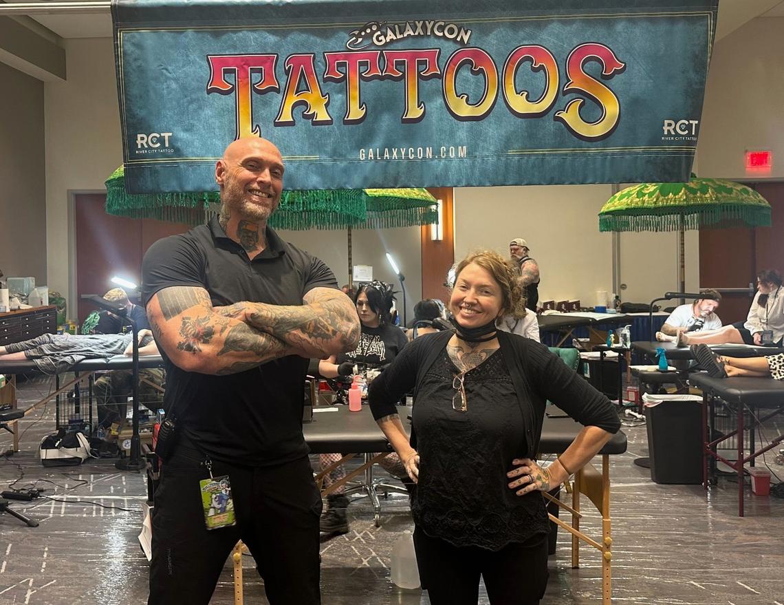 Robert Weaver and Jessica Simmons, co-owners of River City Tattoo Company, at GalaxyCon Raleigh in July 2024. They offer tattoos of select celebrity autographs after they’re signed on the exhibition floor and seek to offer an inclusive experience.