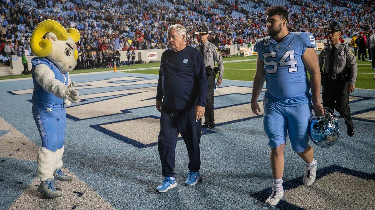 North Carolina coach Mack Brown leaves the field following the Tar Heels’ 30-27 loss to N.C. State on Friday, November 25, 2022 at Kenan Stadium in Chapel Hill, N.C.