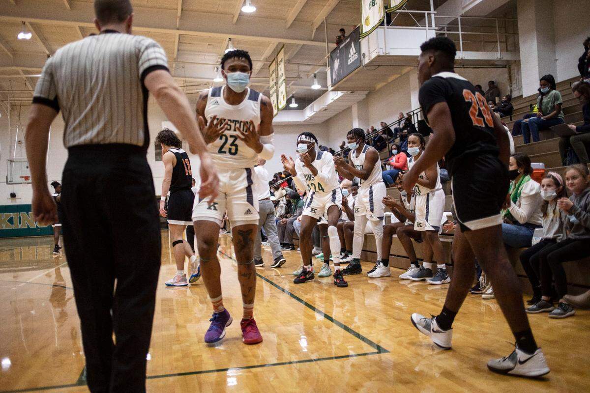 Kinston High players react to one of their teammates blocking Wallace-Rose Hill from scoring during their home game in Kinston, N.C. on Jan. 11, 2022.