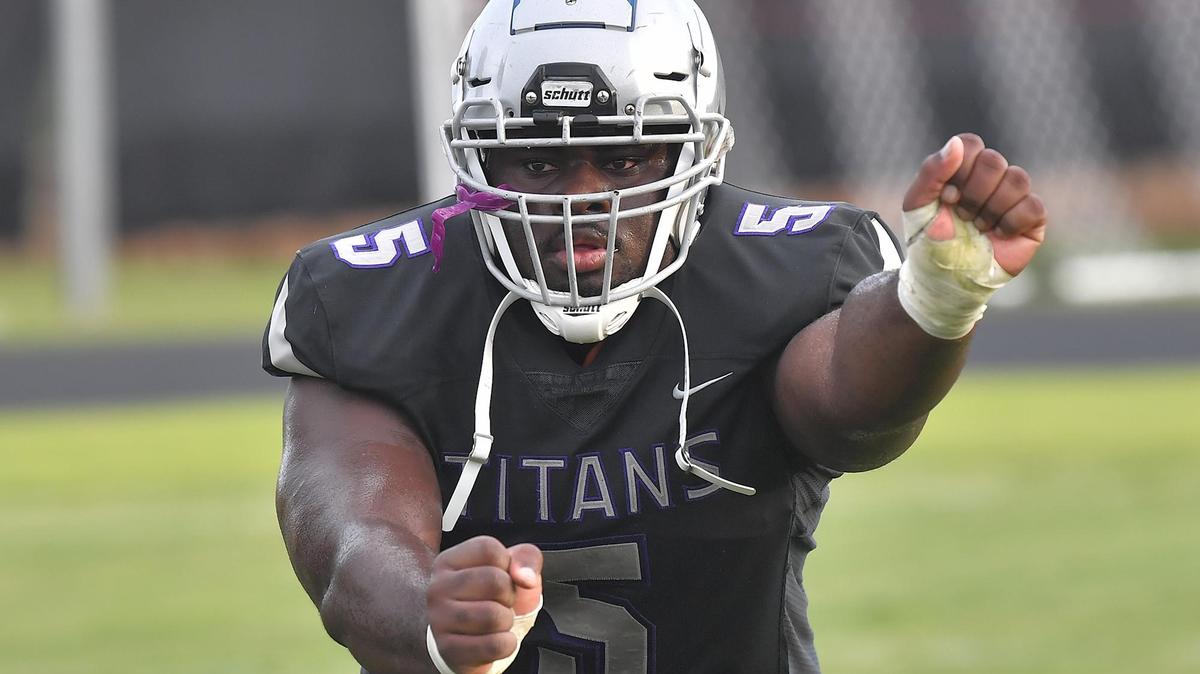 South Garner’s Nnamdi Ogboko (5) takes part in drills before his game against Enloe.The Enloe Eagles and the South Garner Titans met in a non-conference game in Wake Forest, N.C. on September 8, 2023.