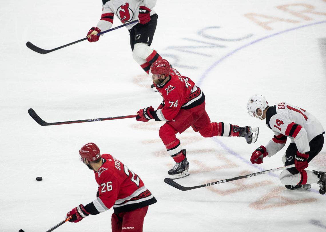 The Carolina Hurricanes Jaccob Slavin (74) breaks away from New Jersey Devils Nathan Bastian (14) in the third period during Game 5 of their second round Stanley Cup playoff series on Thursday, May 11, 2023 at PNC Arena in Raleigh, N.C.