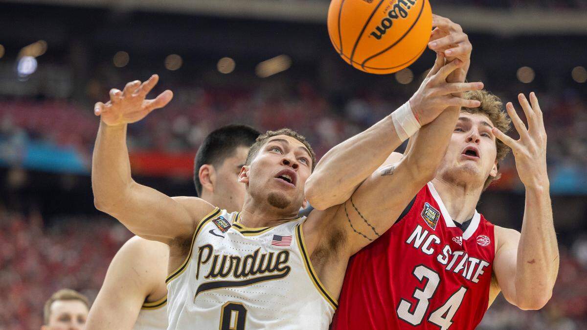 Purdue’s Mason Gillis (0) battles with N.C. State’s Ben Middlebrooks (34) for a rebound during the first half in the NCAA Final Four National Semifinal on Saturday, April 6, 2024 at State Farm Stadium in Glendale, AZ.