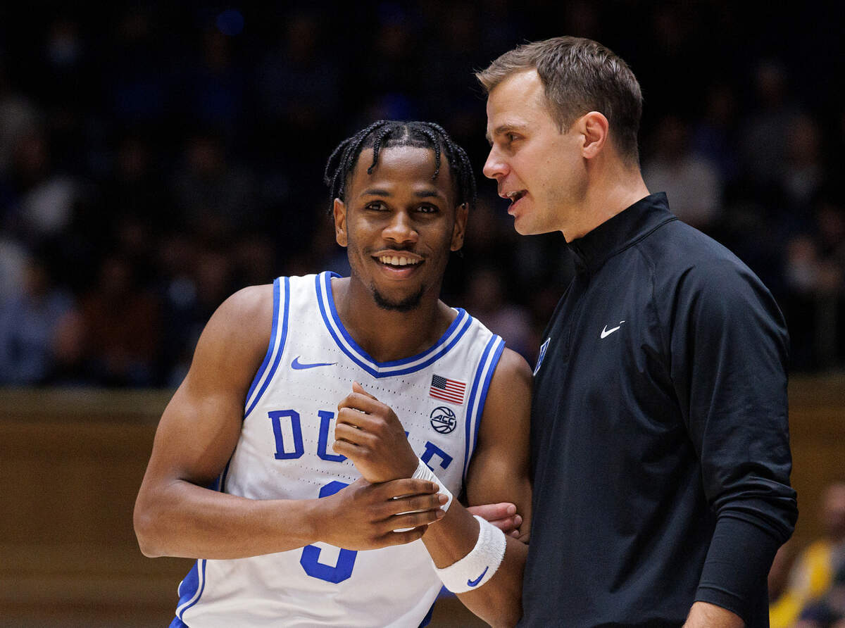 Duke head coach Jon Scheyer has a word with Jeremy Roach during the second half of the Blue Devils’ 95-66 win on Tuesday, Nov. 21, 2023, at Cameron Indoor Stadium in Durham, N.C.