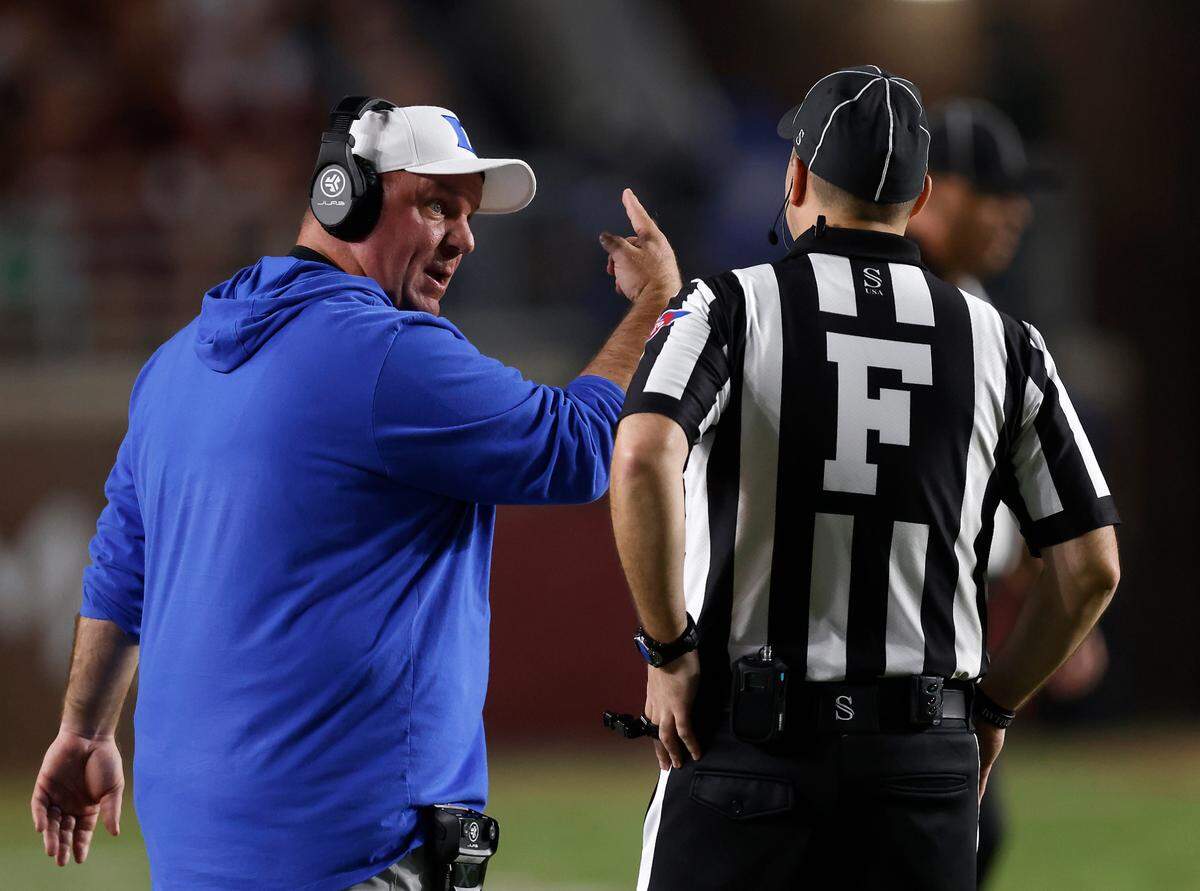 Duke head coach Mike Elko speaks with an official during the first half of the Blue Devils’ 38-20 loss to Florida State on Saturday, Oct. 21, 2023, in Tallahassee, Fla.