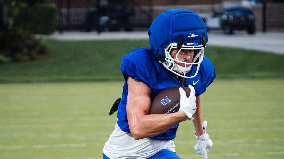 Duke wide receiver Cooper Barkate runs with the football during a practice drill at Brooks Practice Facilty.