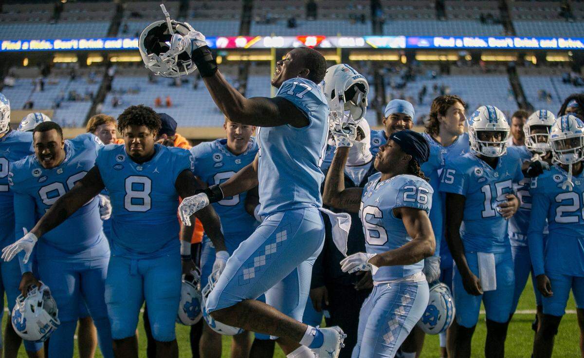 North Carolina’s Chris Collins (17) celebrates with teammates following the Tar Heels’ 41-10 victory over Virginia Tech on Saturday, October 1, 2022 at Kenan Stadium in Chapel Hill, N.C.
