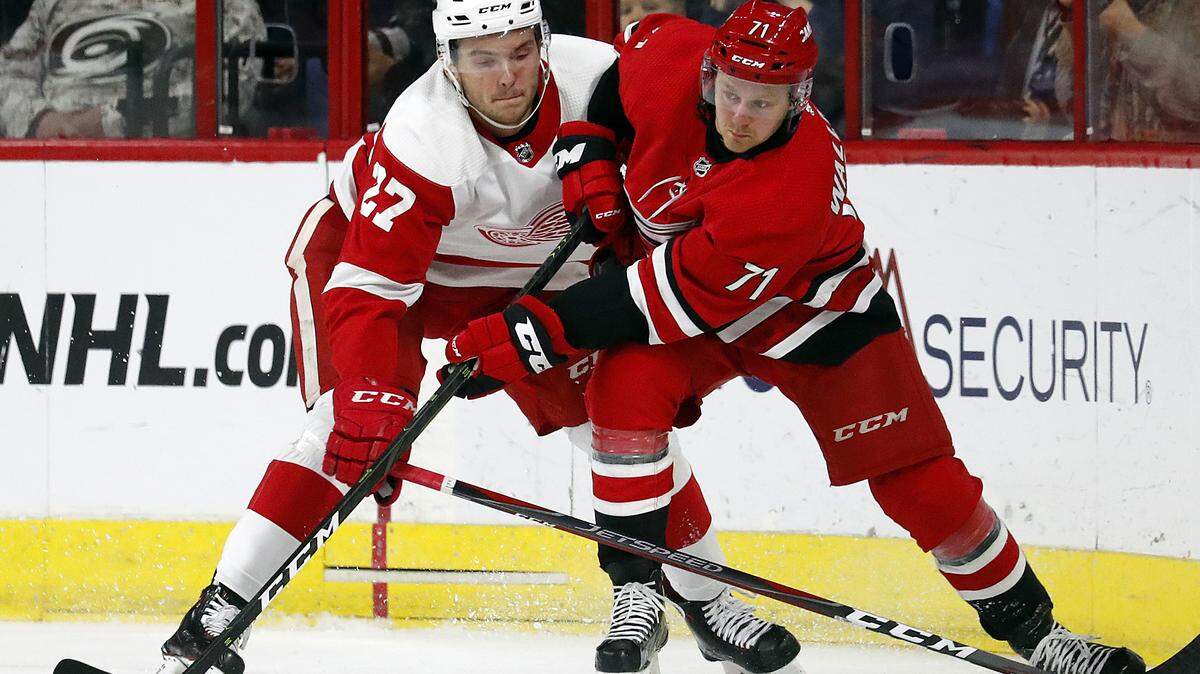 Lucas Wallmark (71) and Michael Rasmussen (27) compete for the puck during the second period of an NHL hockey game Saturday, Nov. 10, 2018,
