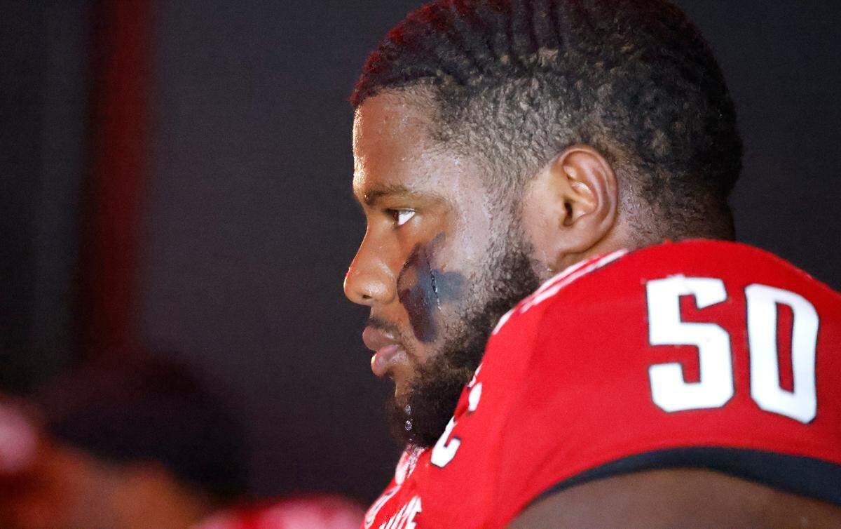 N.C. State center Grant Gibson (50) waits to head out onto the field to warmup before N.C. State’s game against Wake Forest at Carter-Finley Stadium in Raleigh, N.C., Saturday, Nov. 5, 2022.