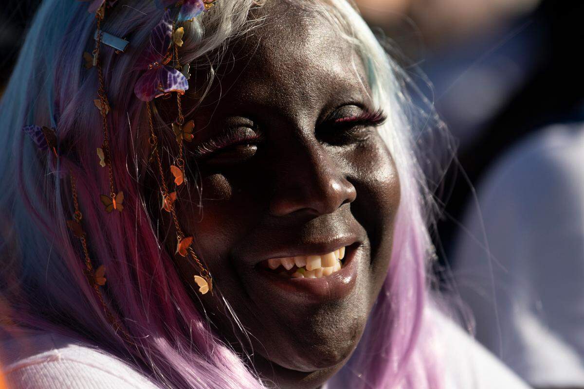 A fan watches a set at the Dreamville Festival in Raleigh, N.C., Saturday, April 1, 2023.