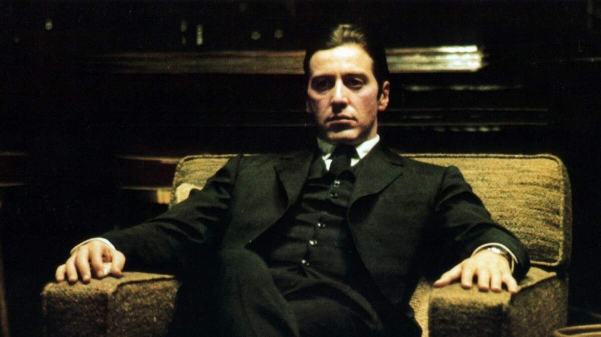 Al Pacino, as Michael Corleone, sits in a chair in a scene from the 1974 film “The Godfather: Part II.”