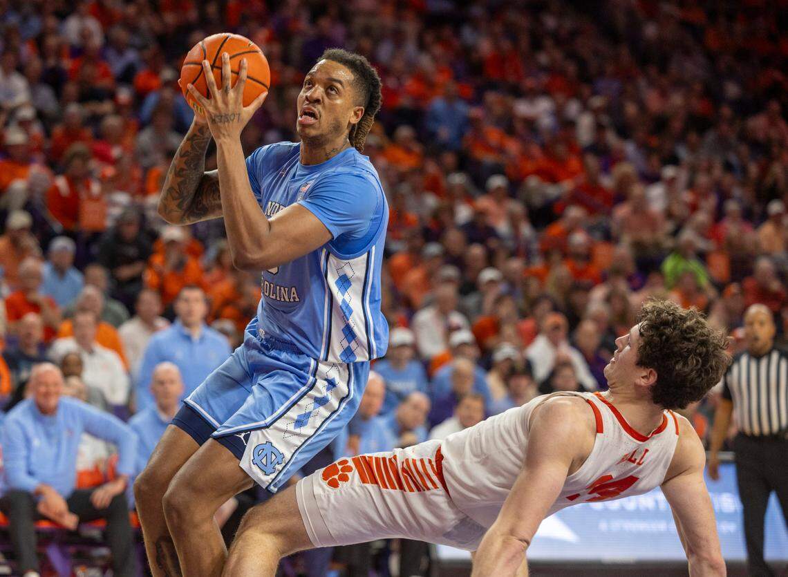 North Carolina’s Armando Bacot (5) collides with Clemson’s P.J. Hall (24) during the second half on Saturday, January 6, 2024 at Littlejohn Coliseum in Clemson, S.C. Hall was called for a blocking foul.
