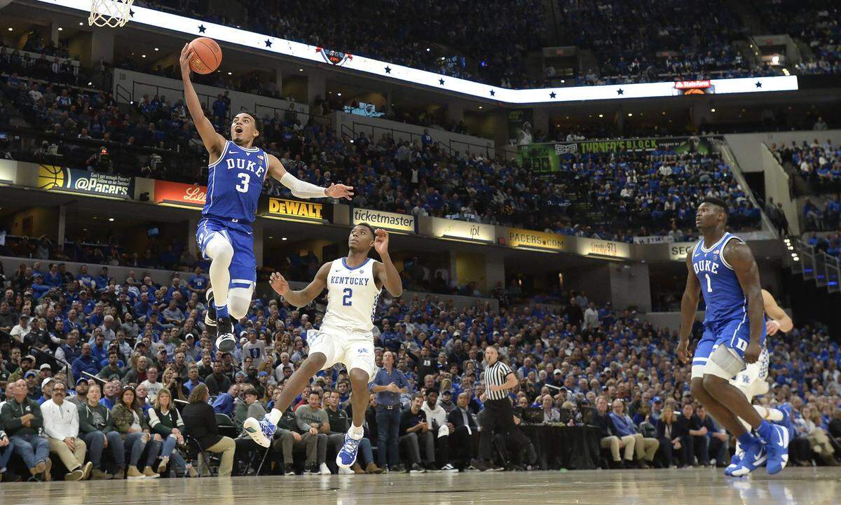 Duke guard Tre Jones (3) floats to the basket in the second half as Kentucky guard Ashton Hagans (2) trails the play. Duke defeated Kentucky 118-84 in the Champions Classic at the Bankers Life Fieldhouse in Indianapolis, Indiana, Tuesday, Nov. 6, 2018.