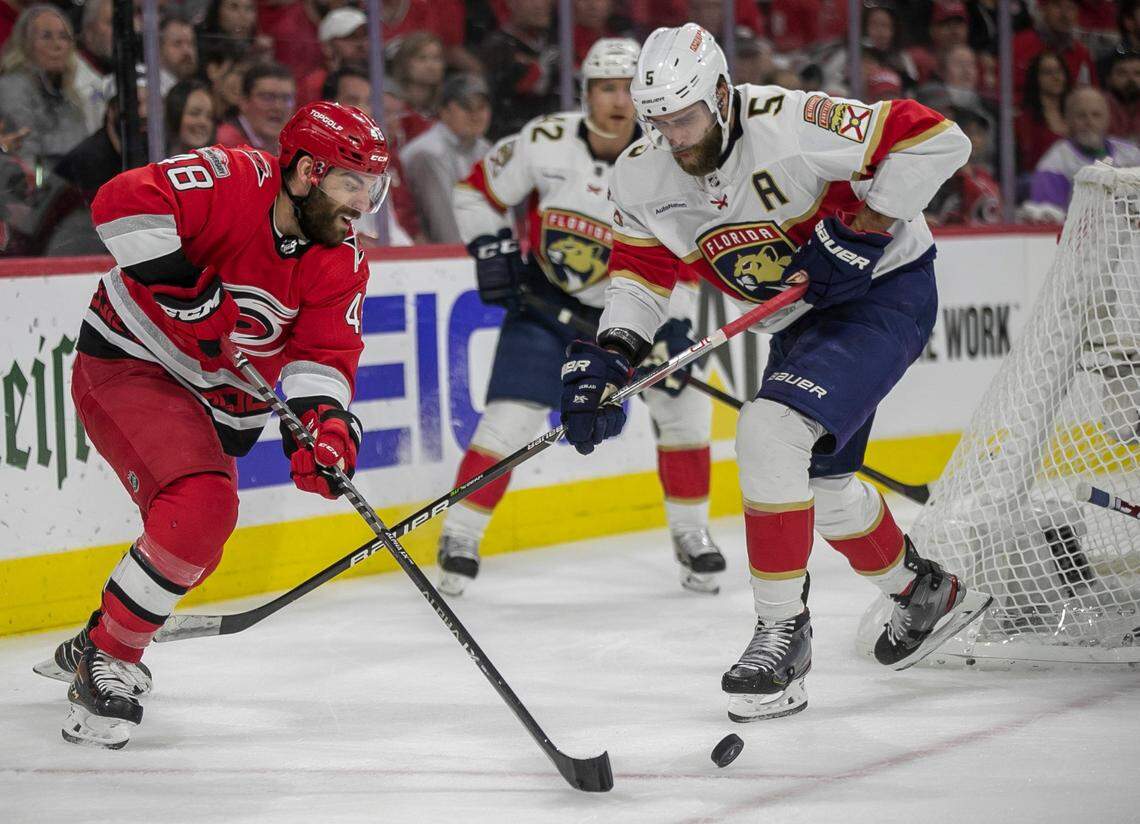 The Carolina Hurricanes Jordan Martinook (48) controls the puck against the Florida Panthers Aaron Ekblad (5) in the first period during Game 2 of the Eastern Conference Finals on Saturday, May 20, 2023 at PNC Arena in Raleigh, N.C.