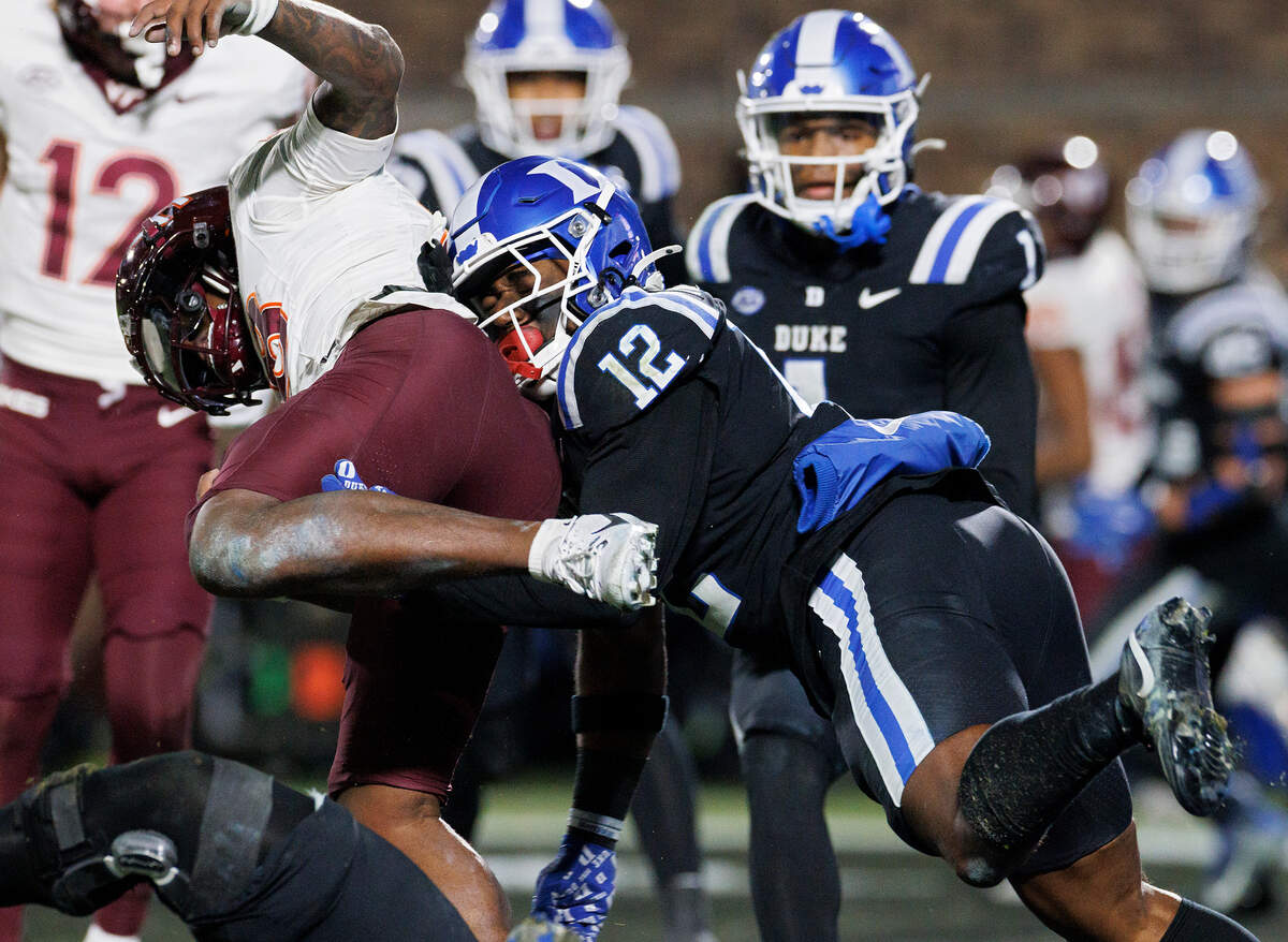 Virginia Tech’s William Watson III powers past Duke’s Tre Freeman for a two-point conversion during the second half of the Blue Devils’ 31-28 win on Saturday, Nov. 23, 2024, at Wallace Wade Stadium in Durham, N.C.