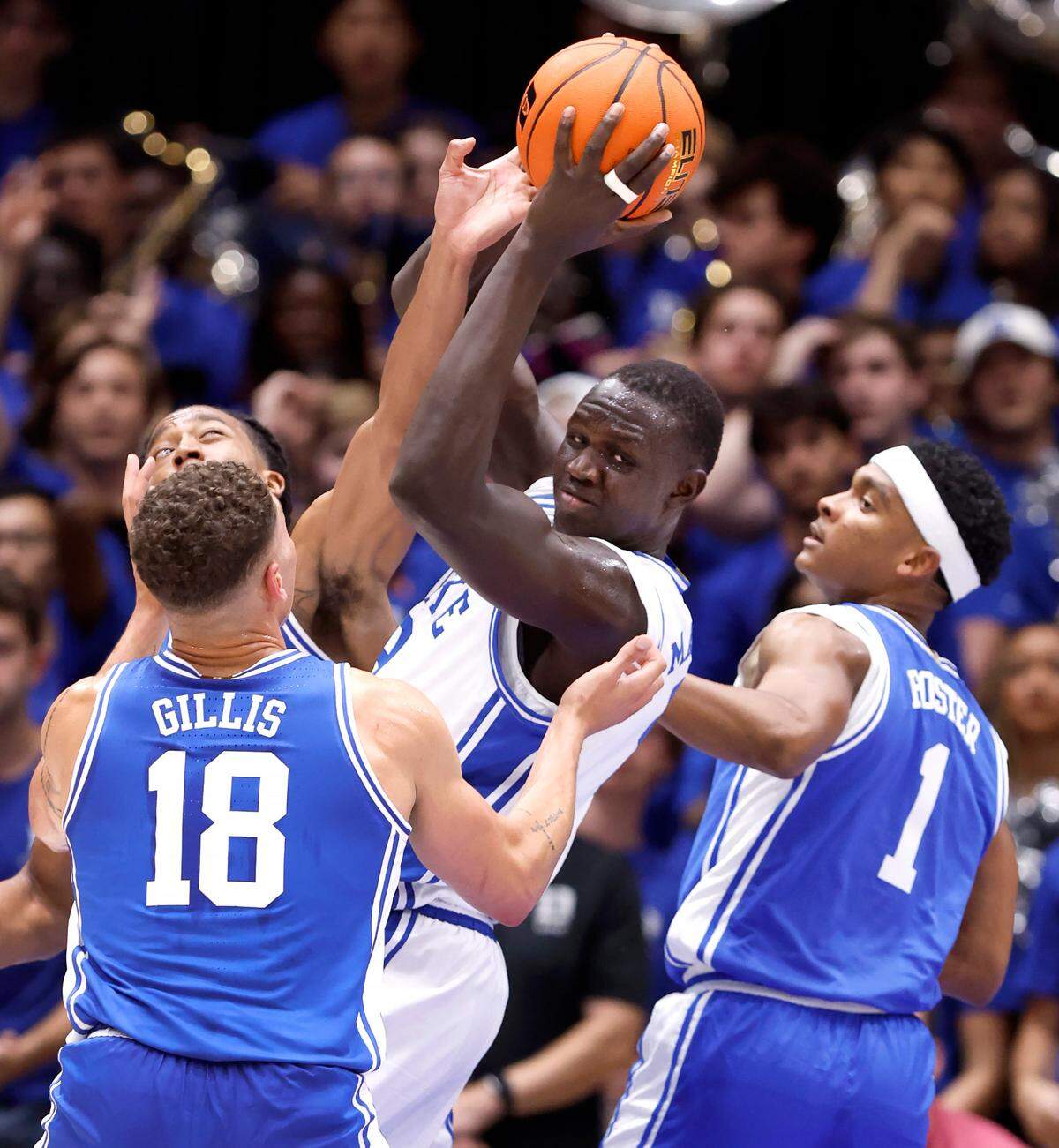 Duke’s Khaman Maluach (9) pulls in the rebound from Maliq Brown (6), Mason Gillis (18) and Caleb Foster (1) during a scrimmage during the Blue Devils’ Countdown to Craziness at Cameron Indoor Stadium in Durham, N.C., Friday, Oct. 4, 2024.