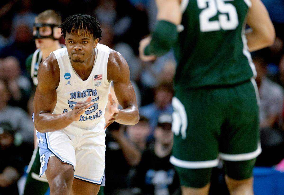 North Carolina’s Harrison Ingram (55) reacts after cutting the Michigan State lead to one point during the first half on Saturday, March 23, 2024, during the second round of the NCAA Tournament at Spectrum Center in Charlotte, N.C.