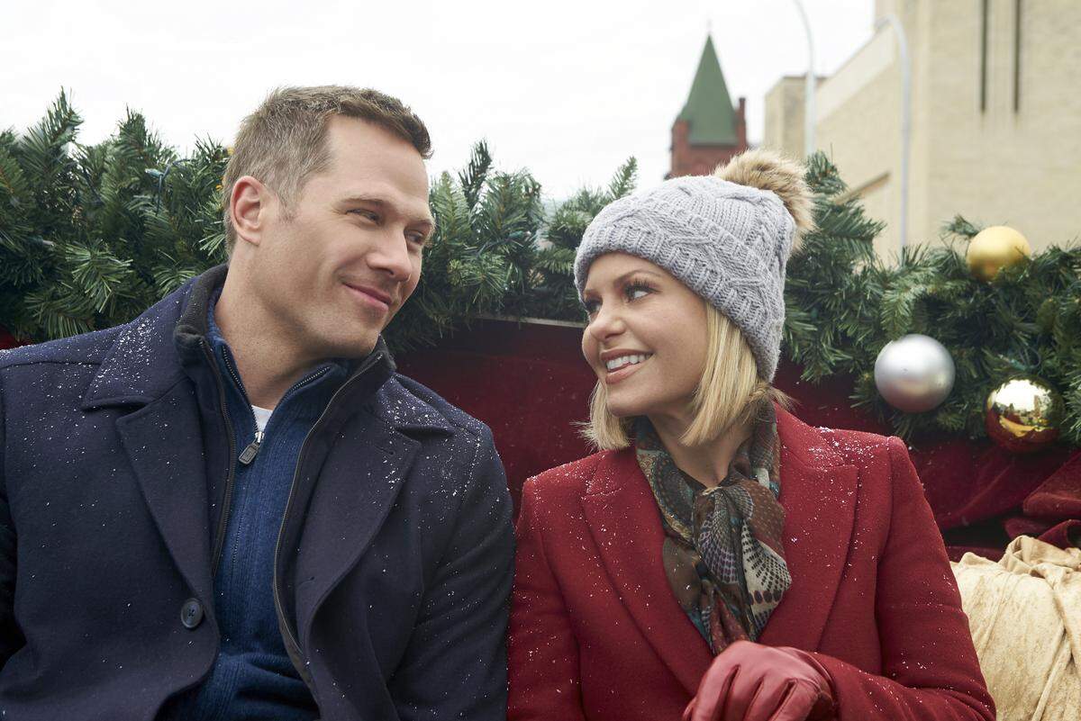 As Christmas approaches, a department store worker whose life lacks fulfillment meets her guardian angel, who offers her a chance to change her circumstances by magically transporting her to Christmases past whenever she tries on a new pair of shoes. But just as things begin to look promising  and she moves toward landing her dream job, improving a family relationship and finding love with a handsome fireman  challenges arise and she begins to lose faith in the Christmas spirit. When she once again revisits a Christmas past, shes offered one last chance for her holiday wishes to come true.     Photo: Luke Macfarlane, Candace Cameron Bure  Credit: ©2018 Crown Media United States LLC/Photographer:&nbsp;Steven Ackerman