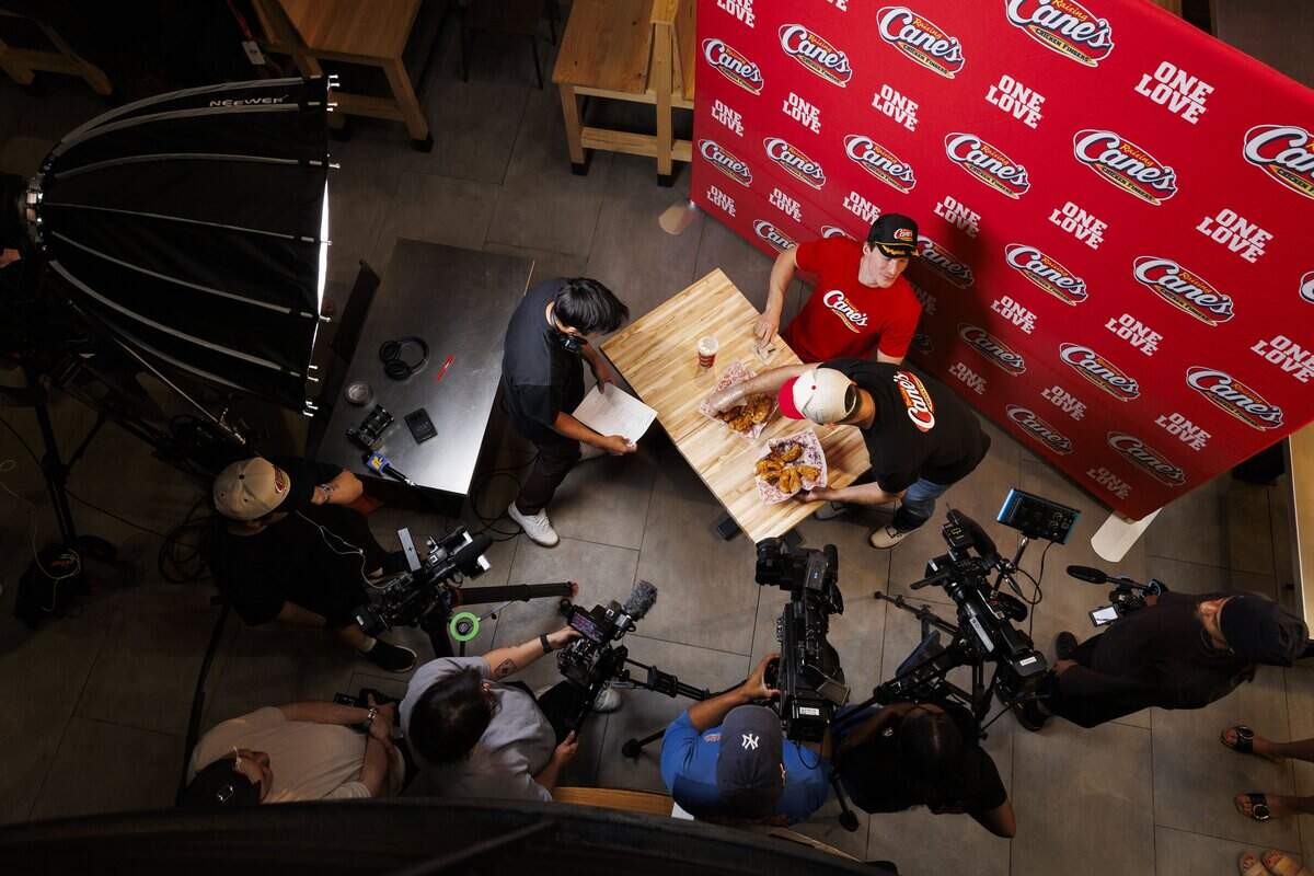 Andrei Svechnikov, winger for the Carolina Hurricanes, was surrounded by cameras at Raising Canes Chicken Fingers during the filming of marketing material for the restaurant on Tuesday, June 15, 2026. The Hurricanes won their second Stanley Cup— with their first being in 2006— on Sunday, June 14.