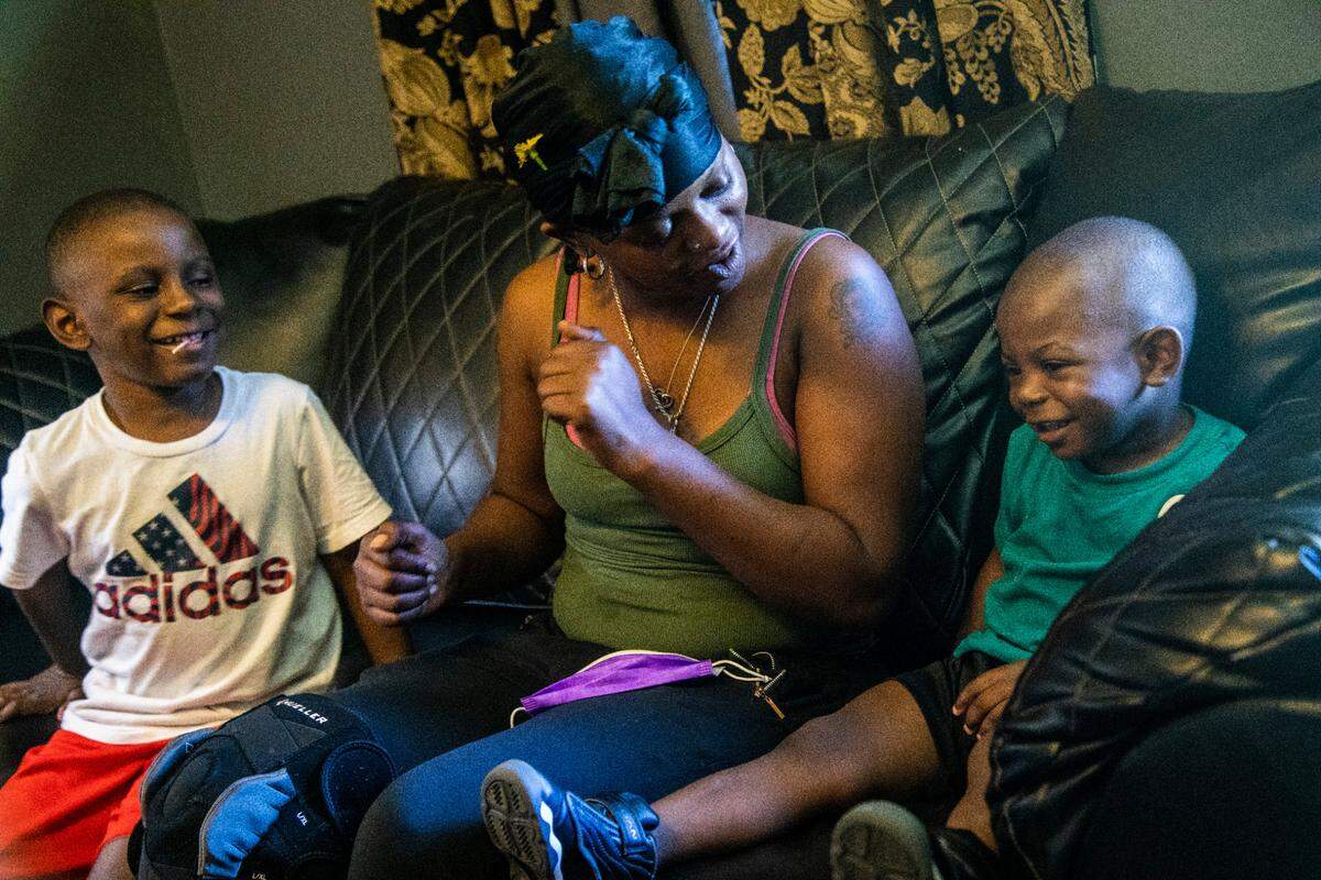 Akilia Jones, 31, spends time with her two sons, Dorian Jones, 6, left, and Quadarius Jones-Prescott, 2, at their apartment in east Durham. Jones is behind on rent and has applied for rental assistance with Durham County, which is prepared to reimburse all her rent arrears, but her landlord Rick Soles won’t accept the money.