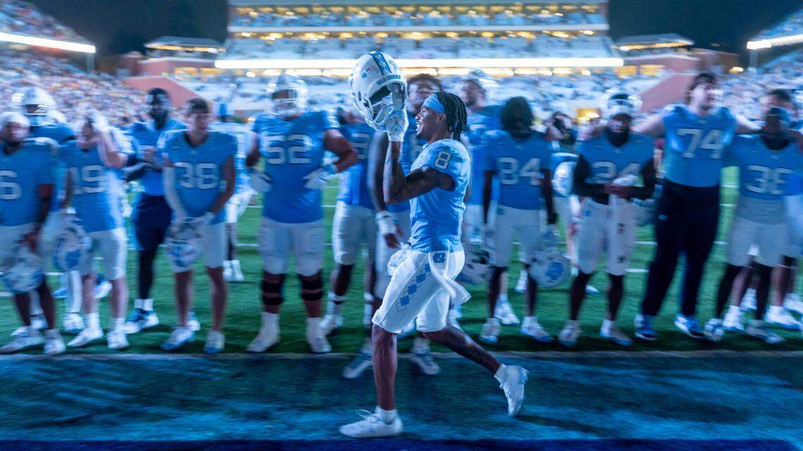 North Carolina’s Kobe Paysour (8) celebrates the Tar Heels’ 40-34 overtime victory against Appalachian State with teammates on Saturday September 9, 2023 at Kenan Stadium in Chapel Hill, N.C.