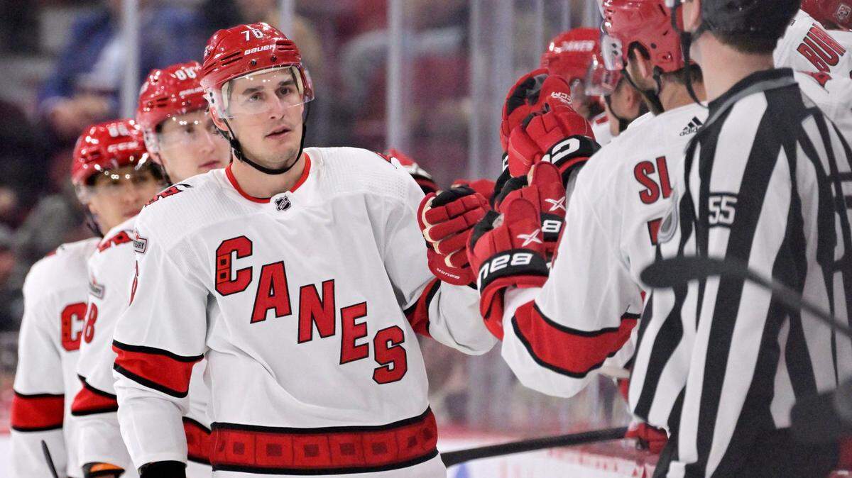 Carolina Hurricanes defenseman Brady Skjei (76) celebrates with teammates after scoring a goal against the Montreal Canadiens during the second period at the Bell Centre.