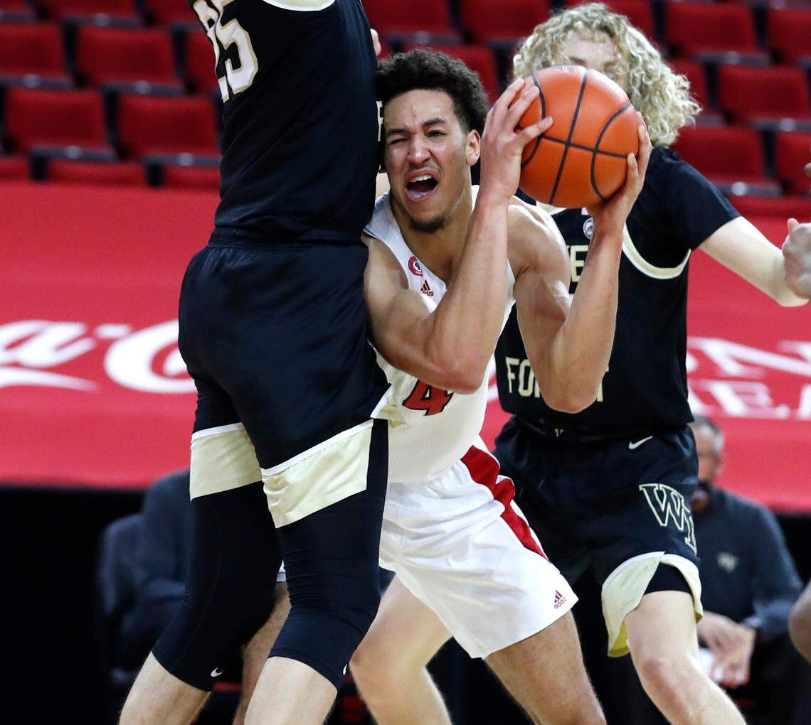N.C. State’s Jericole Hellems (4) tries to get around Wake Forest’s Ismael Massoud (25) during the first half of N.C. State’s game against Wake Forest at PNC Arena in Raleigh, N.C., Wednesday, January 27, 2021.