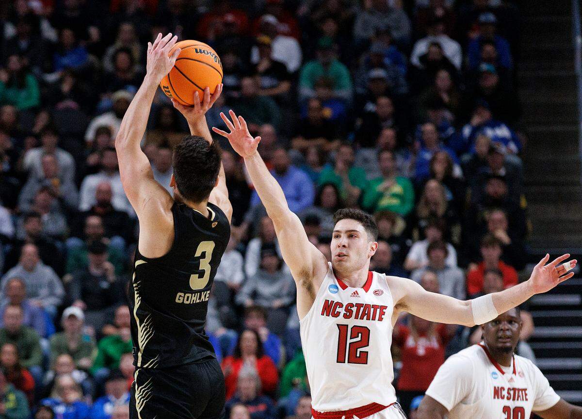 N.C. State’s Michael O’Connell defends a shot by Oakland’s Jack Gohlke in the final seconds of overtime during the Wolfpack’s 79-73 win in the second round of the NCAA Tournament on Saturday, March 23, 2024, at PPG Paints Arena in Pittsburgh, Pa.