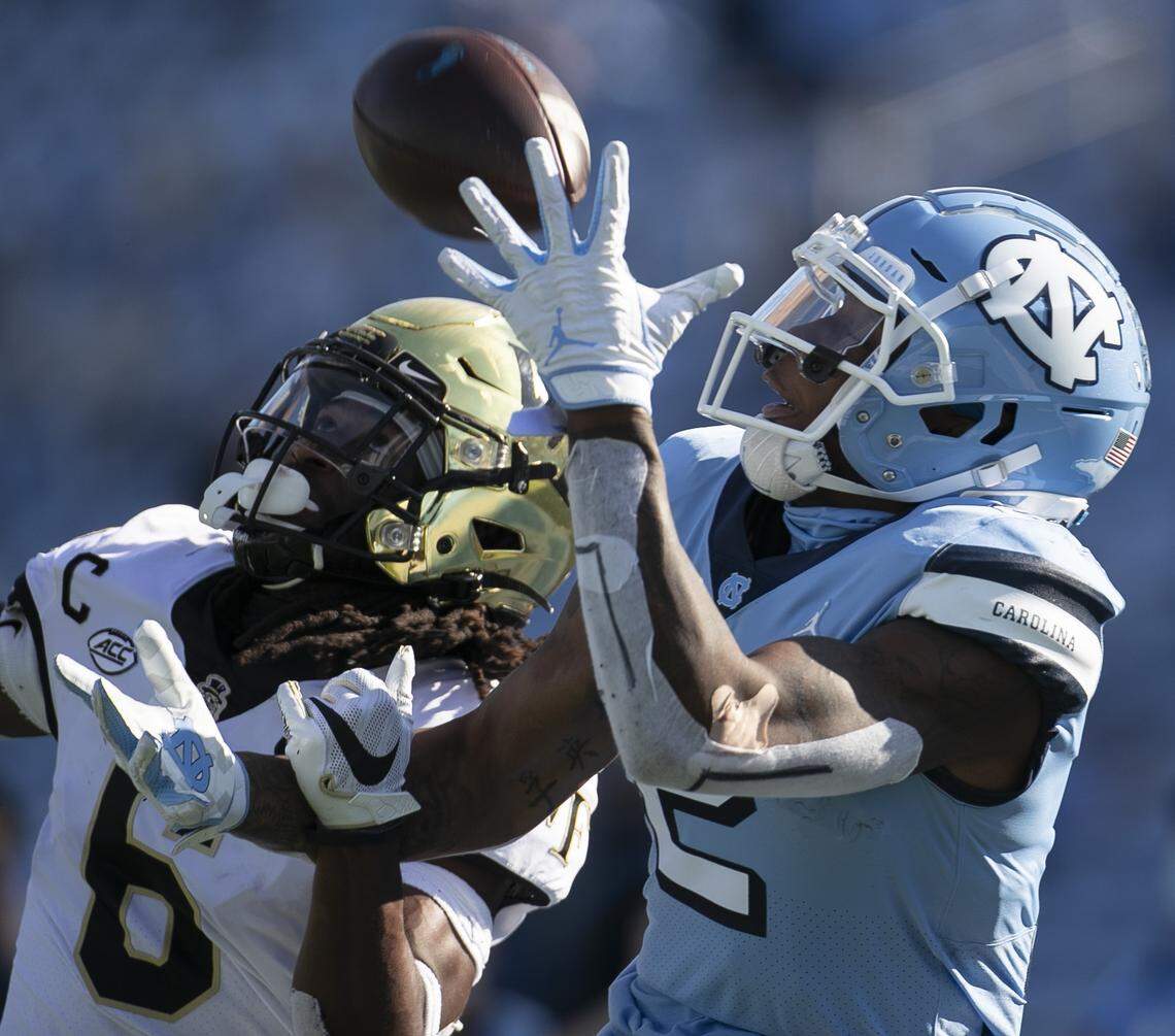 Wake Forest defense back Ja’Sir Taylor (6) defends North Carolina’s Dyami Brown (2) in the second quarter at Kenan Stadium on Saturday, November 14, 2020 in Chapel Hill, N.C. Taylor intercepted the pass.